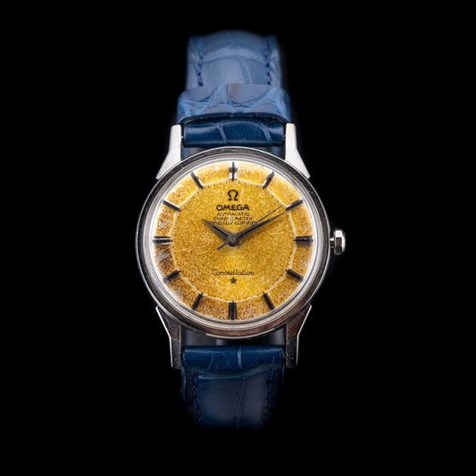Montre Omega Constellation Rusty 1968 cadran Pie Pan patiné cuivre oxydé sur bracelet cuir bleu