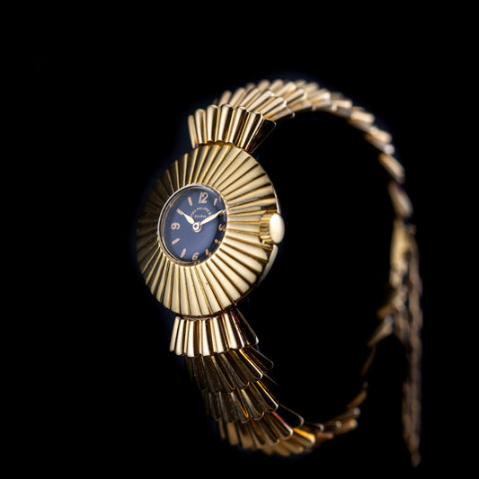 Montre Patek Philippe Épis de blé 1936 boîtier or jaune et bracelet maillons sculptés