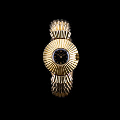 Montre Patek Philippe Épis de blé 1936 cadran bleu et boîtier or sculpté en soleil